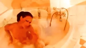 Horny brunette Susana Spears indulges in solo shower masturbation