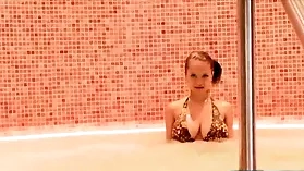 Paris Milan, a teen with big boobs, indulges in a solo jacuzzi session