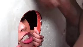 Ebony and ivory beauties engage in hardcore interracial sex with a BBC at a gloryhole