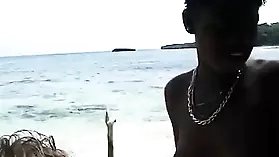 Interracial encounter on the beach with a stunning black woman
